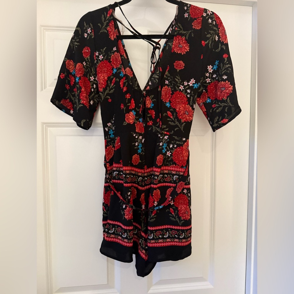 Francesca’s Black and floral romper with belted tie